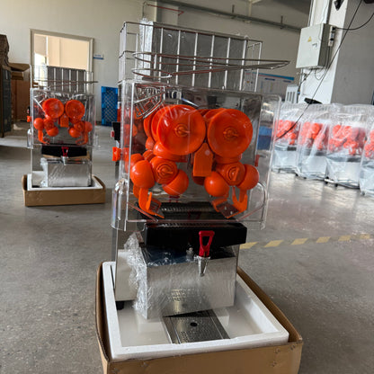 Front factory view of BKN-2000EH commercial orange juicer with citrus pressing mechanism and juice outlet