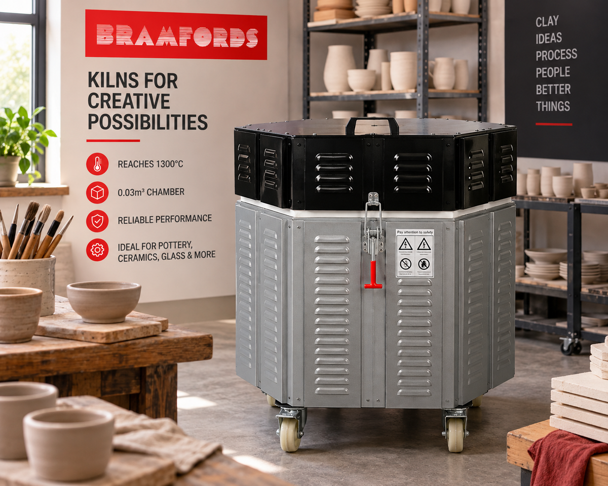 Electric ceramic kiln furnace with black top, gray insulated body and caster wheels