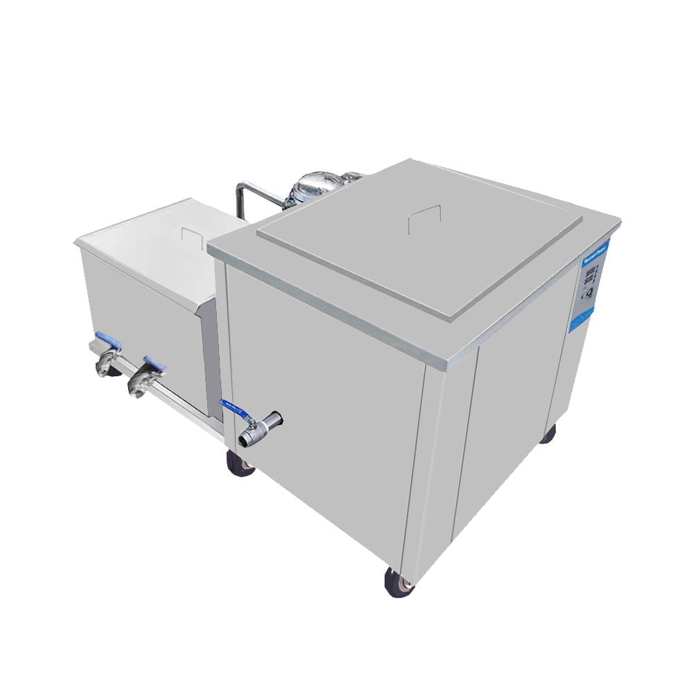 Rear side view of industrial ultrasonic cleaner showing stainless steel tanks and drainage connections